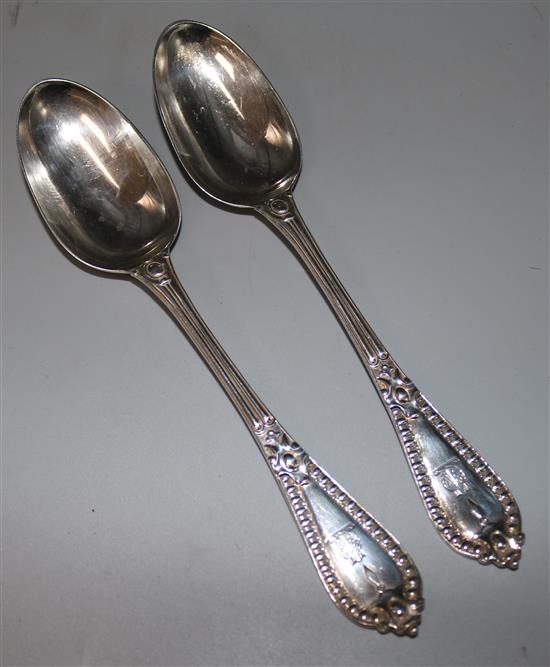 A pair of Victorian silver serving spoons by George Adams, London, 1853.